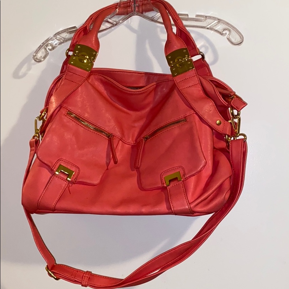Peach and gold colored purse